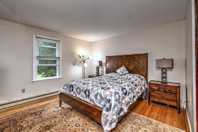 17 Brush Hill Rd, Clinton, CT 06413 - bedroom with wood finished floors and a baseboard radiator