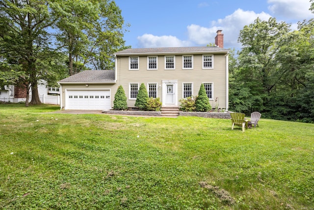 1 Brook Hill Rd, Hamden, CT 06514 - colonial-style house featuring a chimney, a garage, a front lawn, and entry steps
