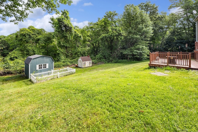 1 Brook Hill Rd, Hamden, CT 06514 - view of grassy yard featuring a storage unit and a deck