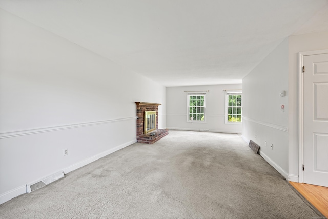 1 Brook Hill Rd, Hamden, CT 06514 - unfurnished living room featuring a brick fireplace and carpet