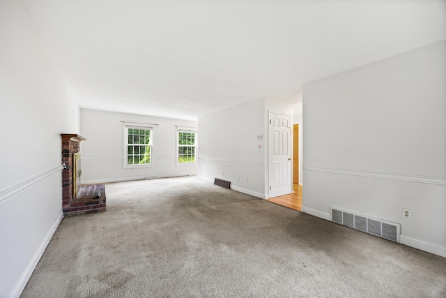 1 Brook Hill Rd, Hamden, CT 06514 - unfurnished living room with carpet flooring and a brick fireplace