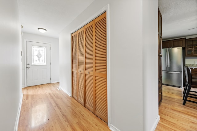 1 Brook Hill Rd, Hamden, CT 06514 - hall with light wood-style flooring and baseboards