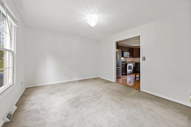 1 Brook Hill Rd, Hamden, CT 06514 - unfurnished room featuring light colored carpet and baseboards
