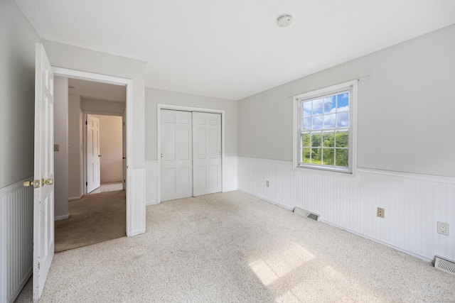 1 Brook Hill Rd, Hamden, CT 06514 - unfurnished bedroom with wainscoting, a closet, and carpet floors