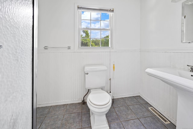 1 Brook Hill Rd, Hamden, CT 06514 - half bathroom with a wainscoted wall and tile patterned flooring