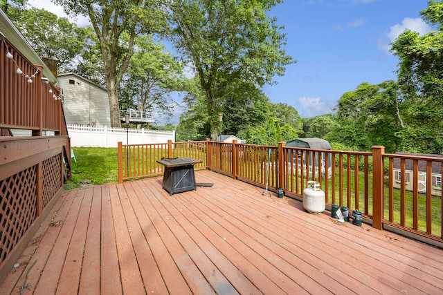 1 Brook Hill Rd, Hamden, CT 06514 - wooden deck featuring a storage shed and view of scattered trees