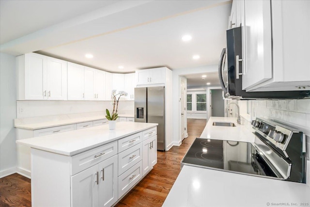 3 Brookside Trl, Monroe, CT 06468 - kitchen featuring stainless steel appliances, white cabinetry, backsplash, dark wood-style flooring, and recessed lighting