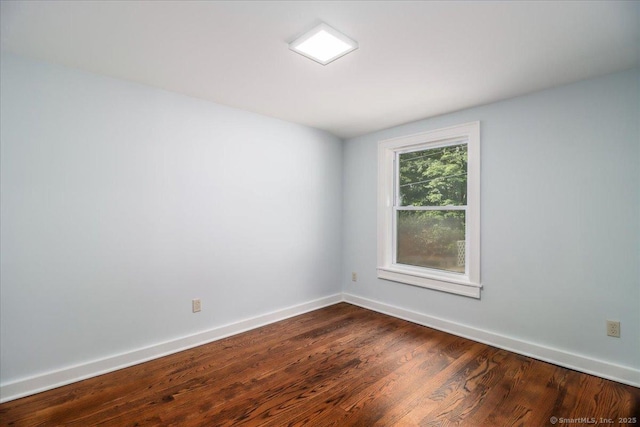 3 Brookside Trl, Monroe, CT 06468 - spare room with dark wood-type flooring and baseboards