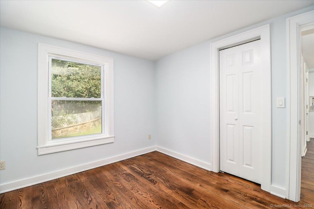 3 Brookside Trl, Monroe, CT 06468 - unfurnished bedroom with dark wood-style floors and baseboards