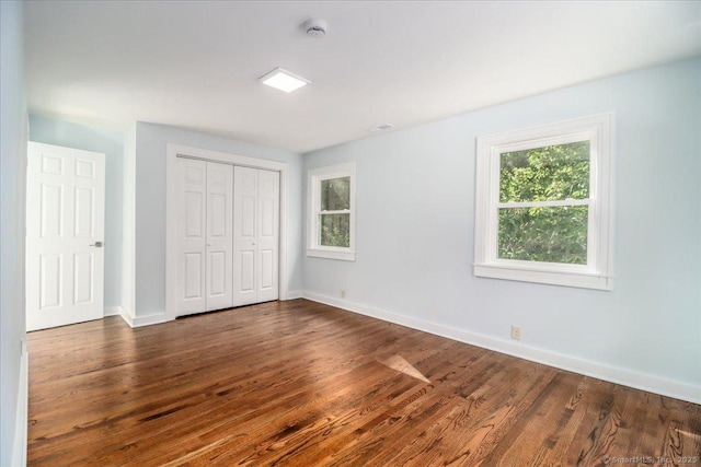 3 Brookside Trl, Monroe, CT 06468 - unfurnished bedroom featuring dark wood-style floors and a closet