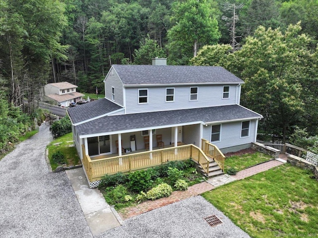 3 Brookside Trl, Monroe, CT 06468 - view of front facade with a porch, a shingled roof, a chimney, and a forest view