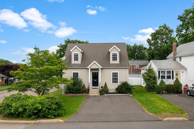 46 Dewey St, Middletown, CT 06457 - new england style home featuring a front lawn and a shingled roof