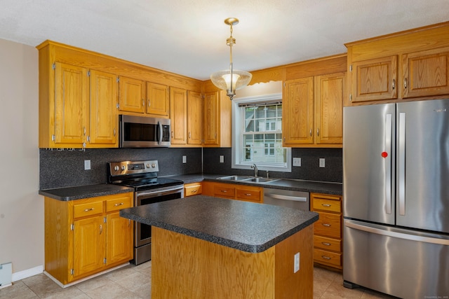 46 Dewey St, Middletown, CT 06457 - kitchen featuring appliances with stainless steel finishes, a sink, backsplash, and dark countertops