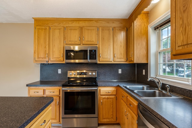 46 Dewey St, Middletown, CT 06457 - kitchen with appliances with stainless steel finishes, dark countertops, and decorative backsplash