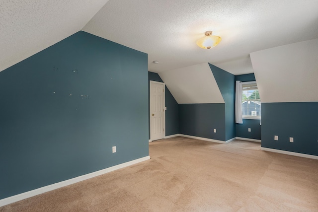 46 Dewey St, Middletown, CT 06457 - bonus room with carpet flooring, vaulted ceiling, baseboards, and a textured ceiling