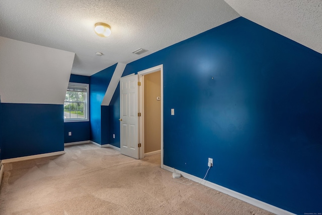 46 Dewey St, Middletown, CT 06457 - additional living space with lofted ceiling, carpet, a textured ceiling, and baseboards