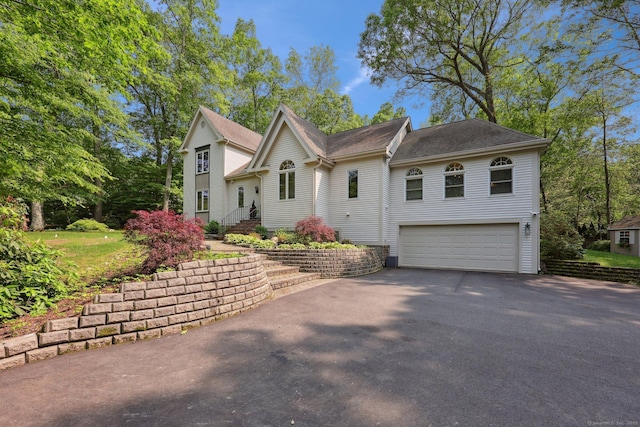 8 Highview Rd, Madison, CT 06443 - view of front of house with asphalt driveway and an attached garage