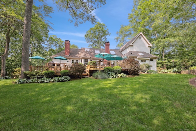 8 Highview Rd, Madison, CT 06443 - back of property featuring a wooden deck, a lawn, and a chimney