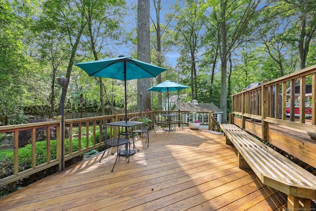 8 Highview Rd, Madison, CT 06443 - wooden deck featuring outdoor dining space and view of scattered trees