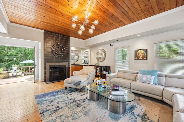 8 Highview Rd, Madison, CT 06443 - living room featuring crown molding, wood ceiling, a chandelier, wood-type flooring, and a tile fireplace