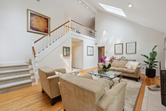 8 Highview Rd, Madison, CT 06443 - living area with a skylight, stairs, wood finished floors, and high vaulted ceiling