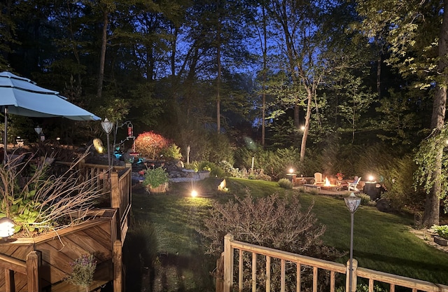 8 Highview Rd, Madison, CT 06443 - yard at twilight with an outdoor fire pit and a lawn