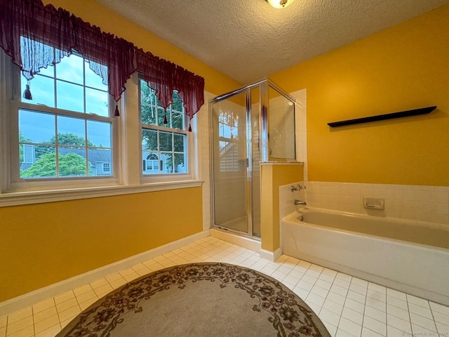 21 Rivendell Dr Unit 21, Shelton, CT 06484 - full bathroom featuring tile patterned floors, plenty of natural light, a garden tub, a stall shower, and a textured ceiling