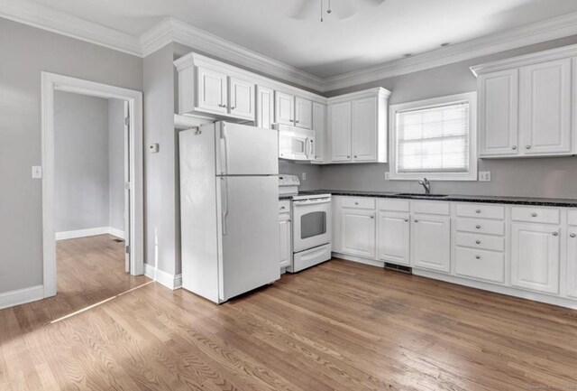 240 Highland Ave, Stratford, CT 06614 - kitchen with white appliances, dark countertops, white cabinets, light wood finished floors, and ceiling fan