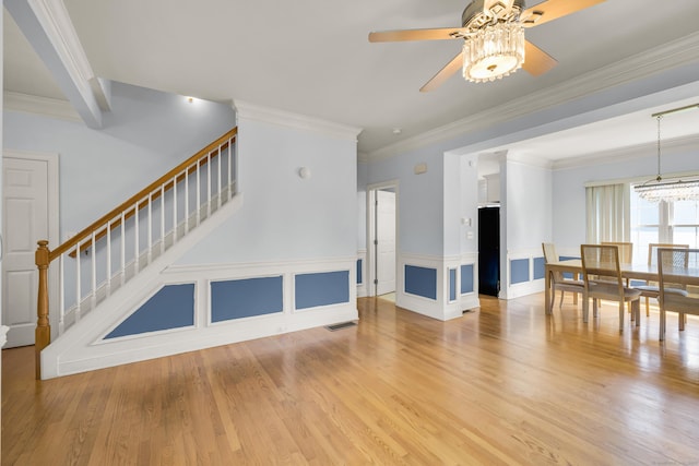 240 Highland Ave, Stratford, CT 06614 - living area with a ceiling fan, stairs, light wood-style floors, and crown molding