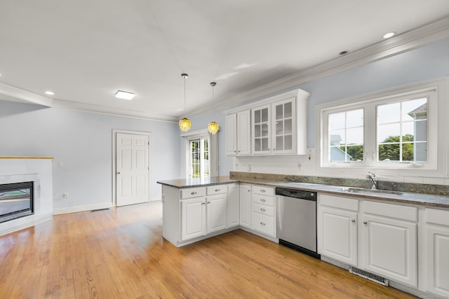 240 Highland Ave, Stratford, CT 06614 - kitchen with dishwasher, a peninsula, white cabinetry, glass insert cabinets, and light wood finished floors