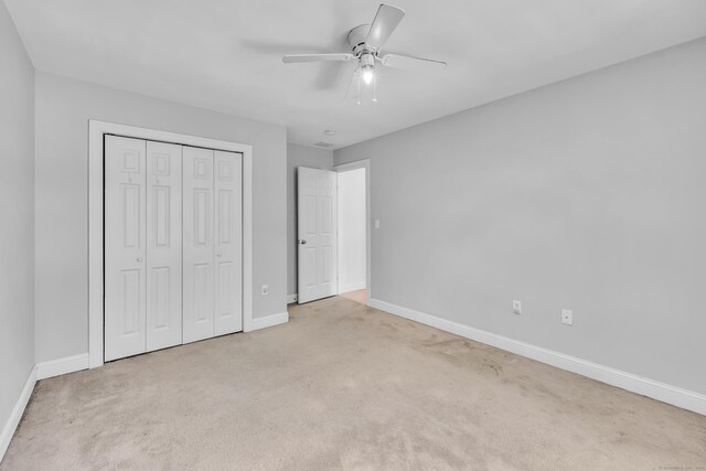 240 Highland Ave, Stratford, CT 06614 - unfurnished bedroom featuring carpet flooring, a closet, and ceiling fan
