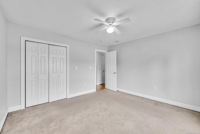 240 Highland Ave, Stratford, CT 06614 - unfurnished bedroom featuring a closet, carpet flooring, and ceiling fan