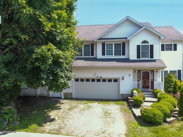 240 Highland Ave, Stratford, CT 06614 - view of front of home featuring a garage, driveway, and a shingled roof