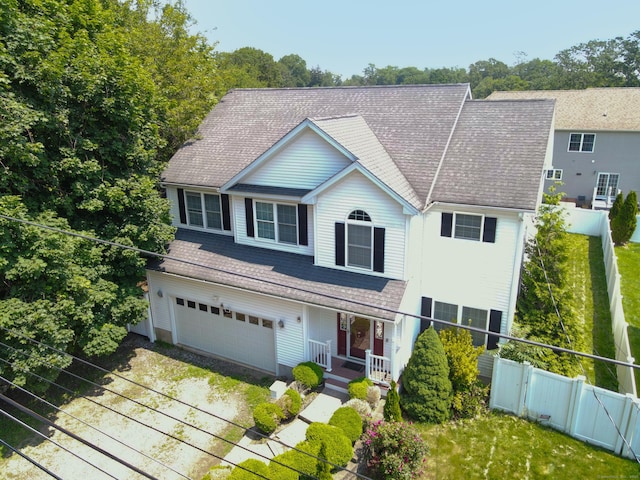 240 Highland Ave, Stratford, CT 06614 - view of front facade featuring a porch, an attached garage, asphalt driveway, and roof with shingles