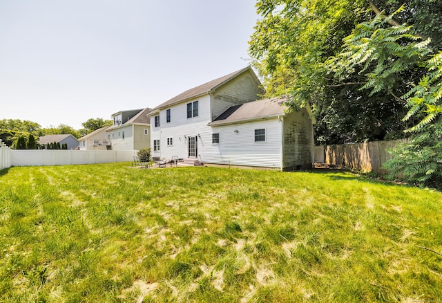 240 Highland Ave, Stratford, CT 06614 - rear view of property with a fenced backyard, entry steps, and a patio area