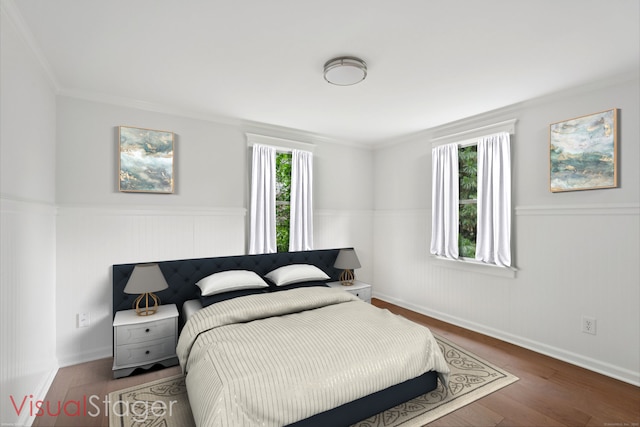 37 Cedar Crest Pl, Norwalk, CT 06854 - bedroom featuring a wainscoted wall, wood finished floors, and crown molding