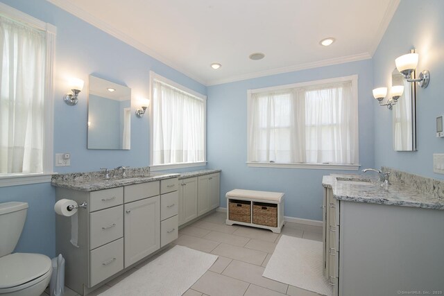38 Fenner Ln, Stonington, CT 06378 - bathroom featuring plenty of natural light, two vanities, ornamental molding, toilet, and recessed lighting