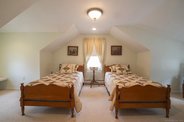 38 Fenner Ln, Stonington, CT 06378 - bedroom featuring baseboard heating, light colored carpet, vaulted ceiling, and baseboards