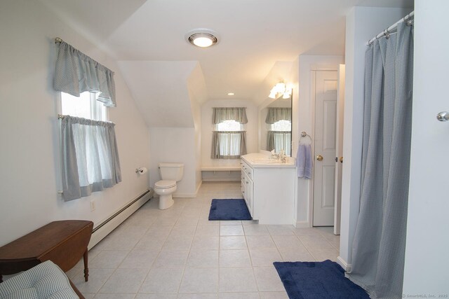 38 Fenner Ln, Stonington, CT 06378 - bathroom with a baseboard heating unit, healthy amount of natural light, tile patterned flooring, vanity, and lofted ceiling