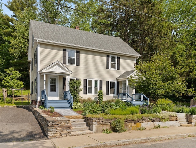 30 Converse St, Stafford, CT 06076 - view of front facade with a chimney and a shingled roof