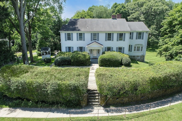 563 Main St, Ridgefield, CT 06877 - colonial house featuring a chimney