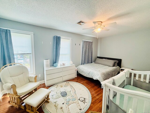 401 Cambridge Commons Unit 401, Middletown, CT 06457 - bedroom with wood finished floors, a textured ceiling, and a ceiling fan