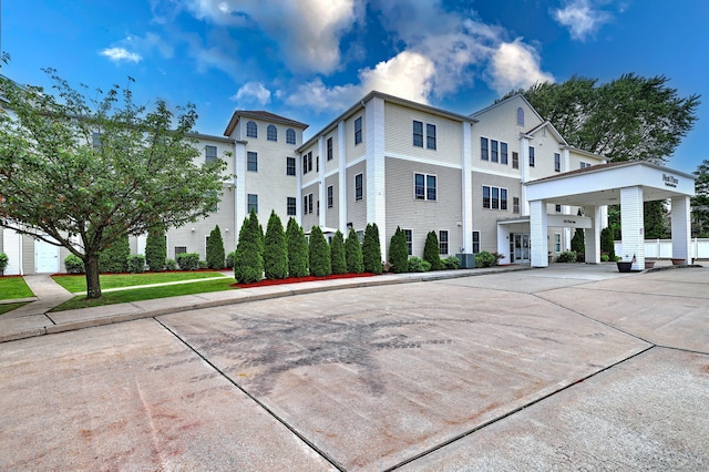 510 First Ave Unit 306, West Haven, CT 06516 - view of property with a carport and concrete driveway
