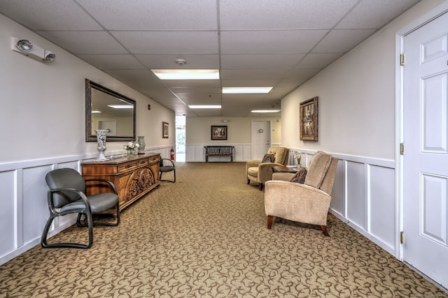 510 First Ave Unit 306, West Haven, CT 06516 - living area with a drop ceiling, a wainscoted wall, and a decorative wall