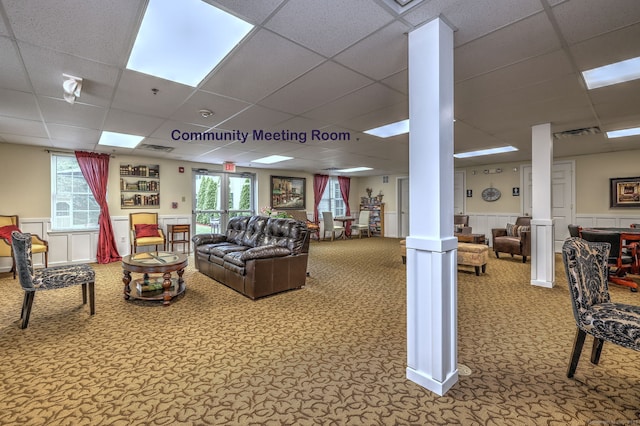 510 First Ave Unit 306, West Haven, CT 06516 - living area featuring ornate columns, a drop ceiling, carpet, and a wainscoted wall