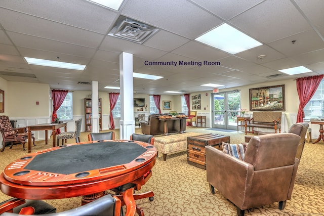 510 First Ave Unit 306, West Haven, CT 06516 - playroom featuring a drop ceiling, carpet, a wainscoted wall, and ornate columns