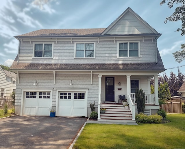 111 Pratt St, Fairfield, CT 06824 - view of front of home with asphalt driveway, a porch, an attached garage, and roof with shingles