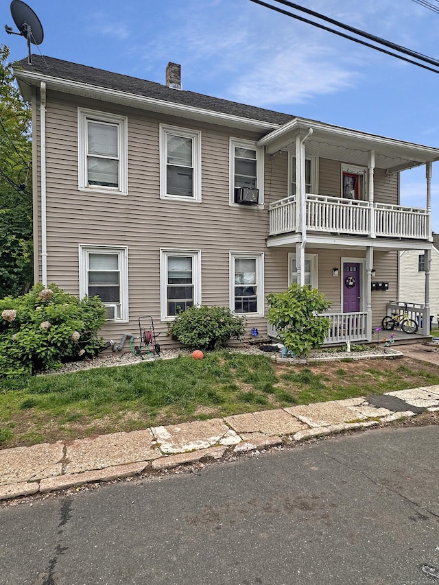 38 Hammond St, Vernon, CT 06066 - view of front of property featuring a balcony, a chimney, covered porch, and cooling unit