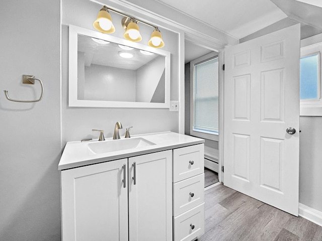 38 Hammond St, Vernon, CT 06066 - bathroom featuring vanity, wood finished floors, and a baseboard radiator