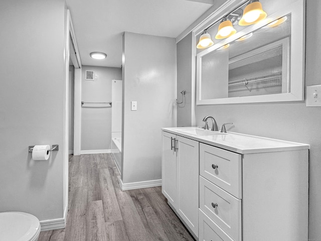 38 Hammond St, Vernon, CT 06066 - full bathroom with wood finished floors and vanity